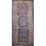 A Bidjar runner, with field of geometric motifs, on a blue ground with multi row border, 10ft 4in by
