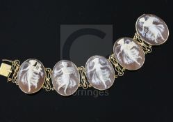 A 14ct gold and oval cameo bracelet, set with five cameos carved with muses, 18cm.