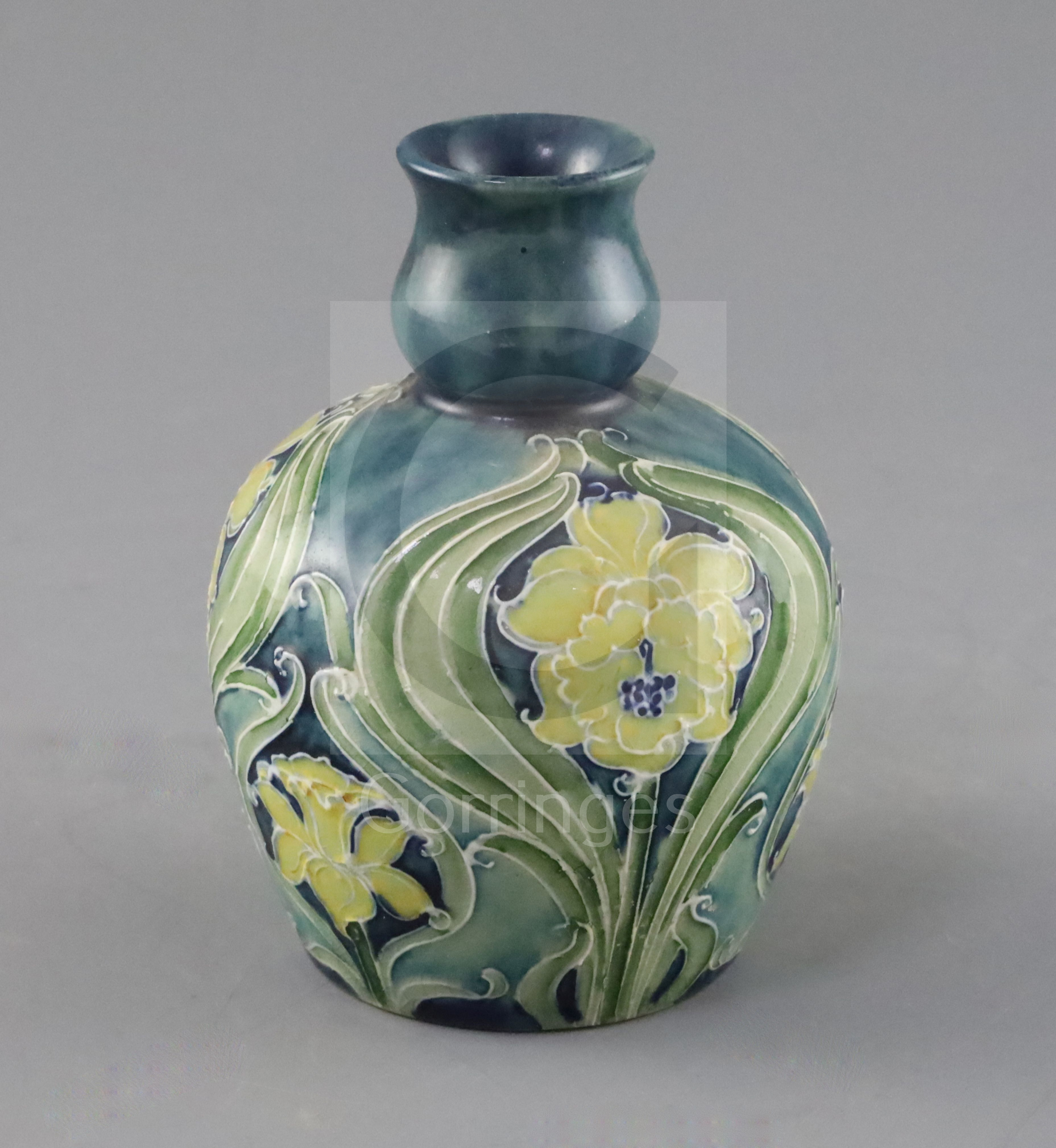 A Moorcroft Florian ware small vase, c.1902-5, decorated predominantly in green, blue and yellow