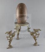 An Indian Lingham stone with 19th century bronze tripod stand, overall H.18in.Ex Alain Presencer
