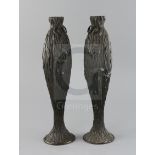 A pair of Japanese bronze vases, Meiji period, each of slender baluster form, modelled in high