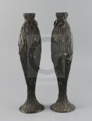 A pair of Japanese bronze vases, Meiji period, each of slender baluster form, modelled in high