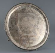 A late Victorian large silver circular salver by Walter & John Barnard, with beaded border, on