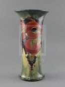 An early Moorcroft 'pomegranate' trumpet shaped vase, c.1917, with a buff / pale blue mottled