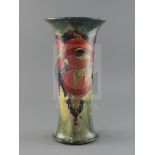 An early Moorcroft 'pomegranate' trumpet shaped vase, c.1917, with a buff / pale blue mottled