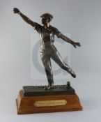 Émile Grégoire (1871-1948). A bronze boulle trophy, depicting a boulle player about to cast a throw,