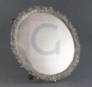 An early George III silver circular salver, by Richard Rugg I, with cast pierced trellis border