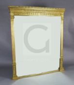 A late Victorian gilt gesso overmantel mirror, decorated with classical motifs, W.4ft 8in. H.5ft