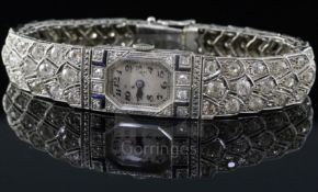 A lady's mid 20th century 18ct white gold, sapphire and diamond set manual wind cocktail watch, with