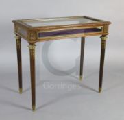 An early 20th century French ormolu mounted mahogany display table, with rising top and foliate