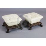 A pair of William IV mahogany footstools, with cushion shaped buttoned pads over a gadrooned