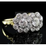 An 18ct yellow gold, platinum and diamond double cluster ring, approx 2.2ct total, size N.