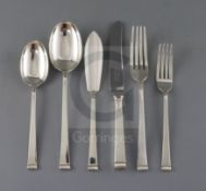 A George VI Art Deco silver canteen of cutlery for twelve, by Cooper Brothers & Sons, comprising one