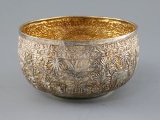 A late 19th/early 20th century Indian Lucknow silver bowl, embossed with continuous scene of animals