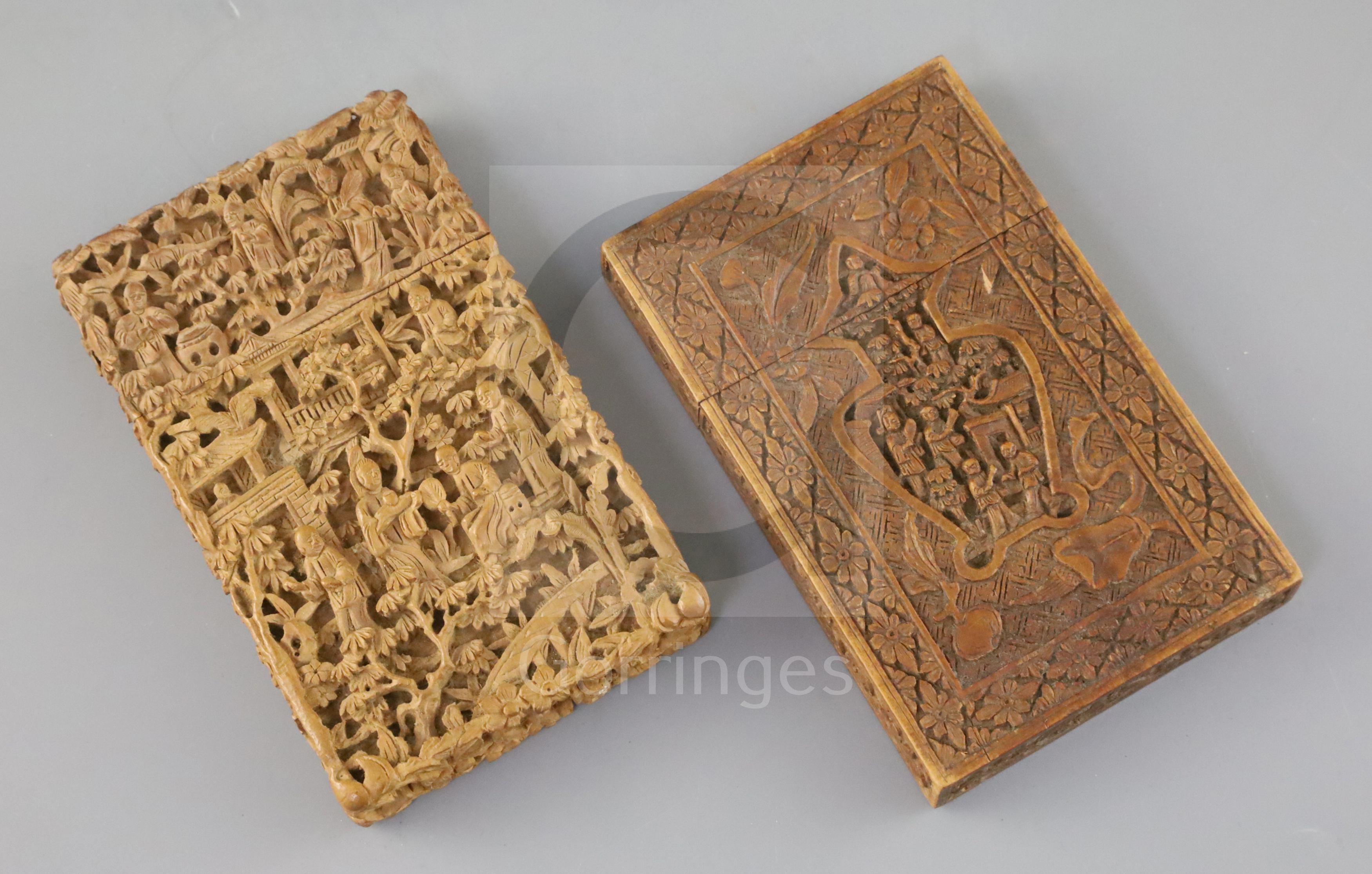 Two Chinese export sandalwood card, 19th century, both carved in high relief with figures amid