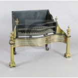 A George III brass and cast iron fire grate, with pierced serpentine front, replacement back and