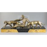Michel Decoux (1837-1924). An Art Deco bronze group of a reclining woman with two panthers, on