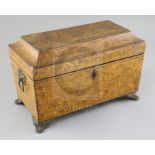 A Regency penwork sarcophagus tea caddy, decorated with exotic flowers, the interior with two