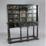 A 17th/18th century Italian and later pietra dura and ebony veneered cabinet on an ebonised wood