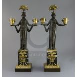 A pair of 19th century French classical revival bronze and ormolu candelabra, modelled with