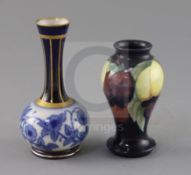 A small Moorcroft 'wisteria' vase and a Macintyre bottle vase, 1920's and c.1905, the former with