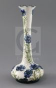 A Moorcroft Florian ware 'blue poppy' vase, Rd. no. for 1902, the blue poppies on a cream ground,