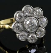 An 18ct gold and diamond cluster flowerhead ring, with a total diamond weight of approximately 2.