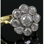 An 18ct gold and diamond cluster flowerhead ring, with a total diamond weight of approximately 2.