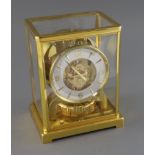 A Jaeger le Coultre Atmos clock, with lacquered gilt case, movement number 377751, H.9in.