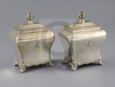 A pair of Victorian silver bombe shaped tea caddies by Henry Wilkinson & Co, with engraved crest and