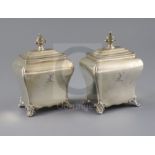 A pair of Victorian silver bombe shaped tea caddies by Henry Wilkinson & Co, with engraved crest and