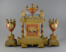 A 19th century French ormolu and porcelain classical revival clock garniture, decorated with