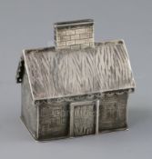 A 19th century Russian 84 zolotnik silver money box modelled as a dacha, with engraved decoration,