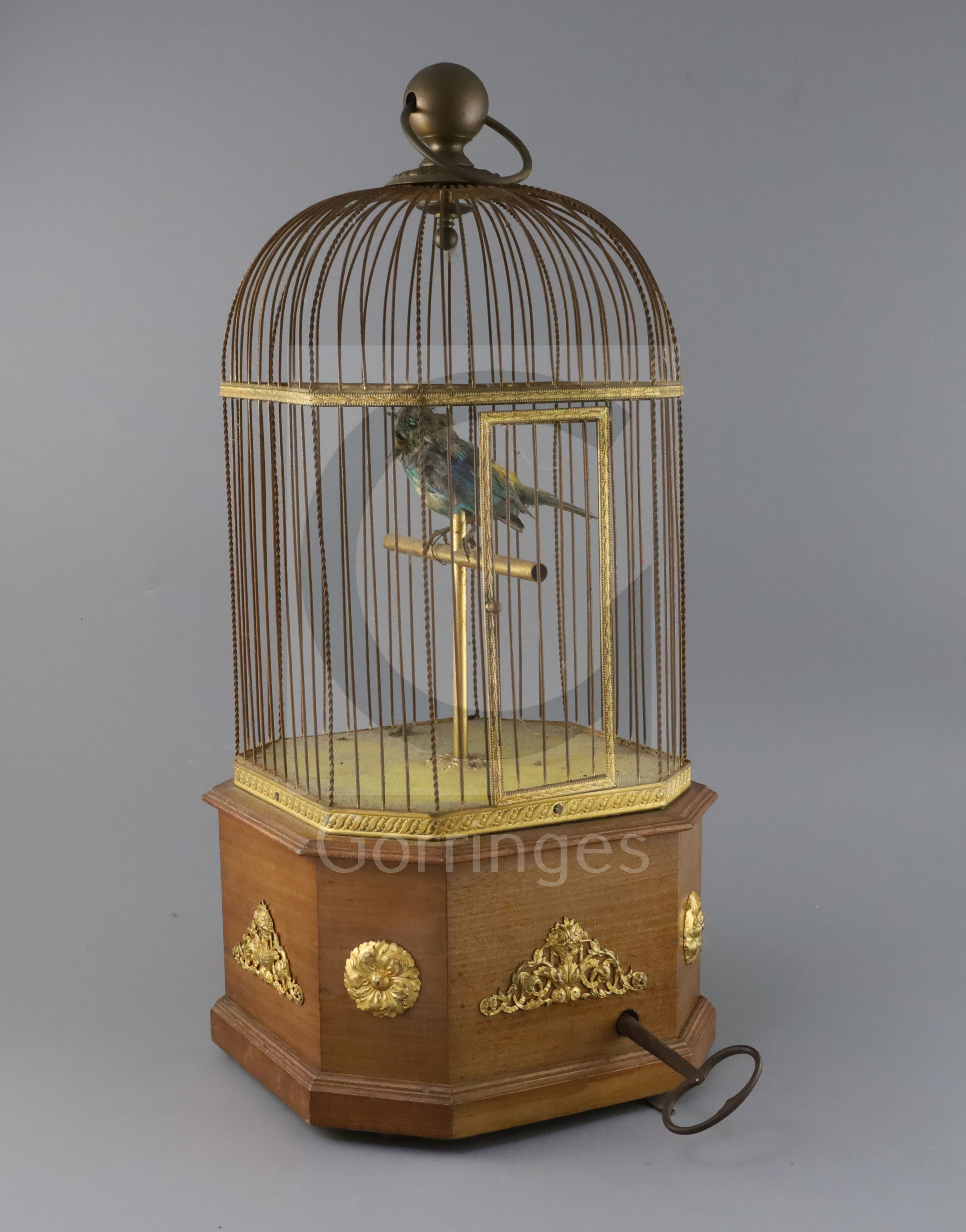 An early 20th century Swiss gilt metal mounted mahogany singing bird in a cage automaton, H.21in.