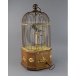 An early 20th century Swiss gilt metal mounted mahogany singing bird in a cage automaton, H.21in.