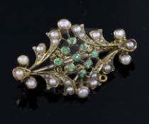 An Edwardian gold, split pearl and demantoid garnet set brooch, the back with engraved