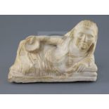 An alabaster cinerary urn cover, probably Etruscan 3rd-2nd century B.C., carved as the reclining