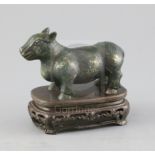 A Chinese gold and silver inlaid bronze figure of a tapir, Han dynasty or later, L. 12cm,