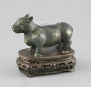 A Chinese gold and silver inlaid bronze figure of a tapir, Han dynasty or later, L. 12cm,