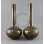 A pair of large Japanese bronze and mixed metal bottle vases, Meiji period, decorated with birds and