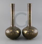 A pair of large Japanese bronze and mixed metal bottle vases, Meiji period, decorated with birds and