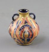 A Moorcroft Macintyre pink Florian ware miniature two handled vase, c.1904-08, decorated with