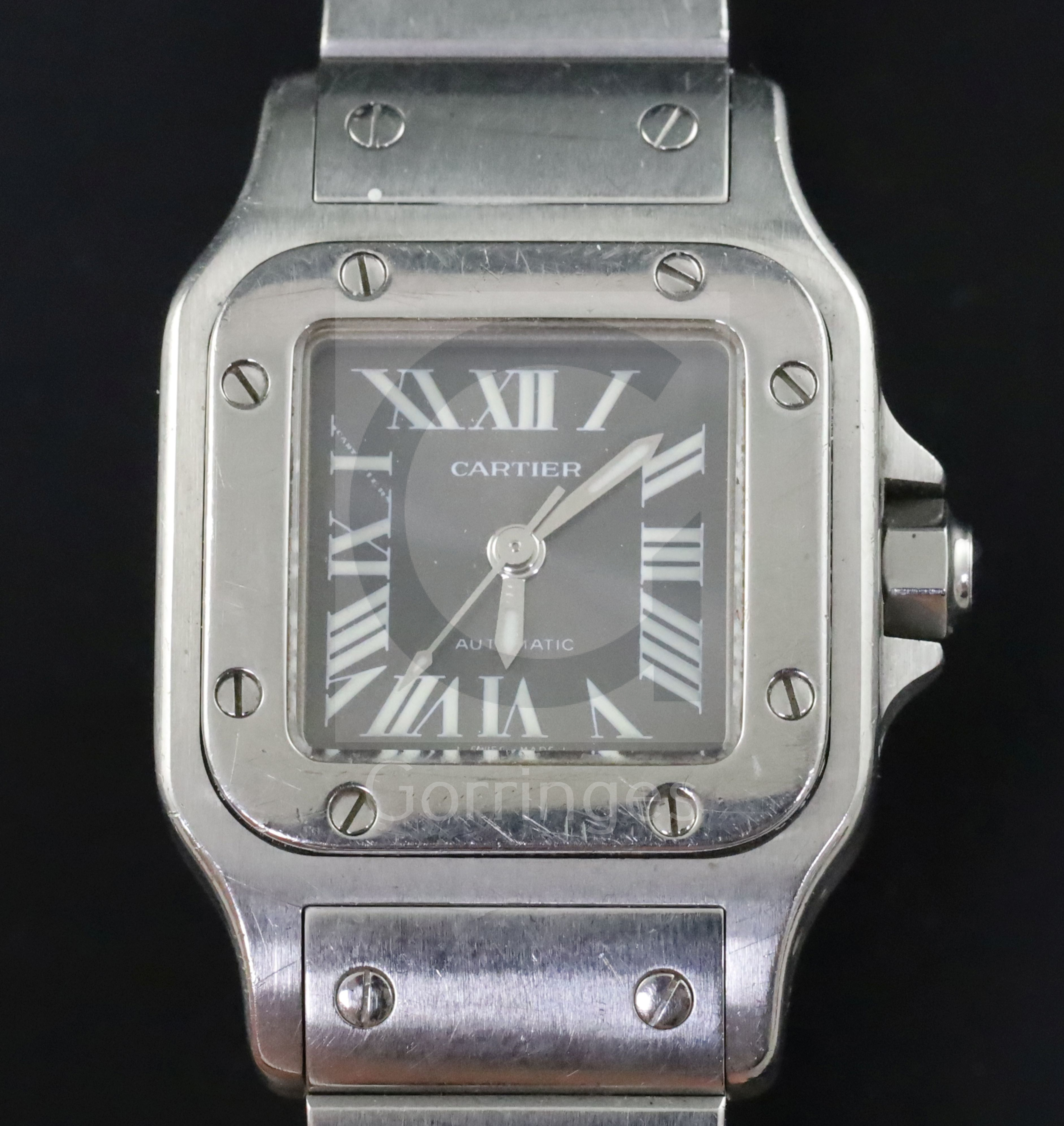 A lady's 2003 stainless steel Cartier Santos automatic wrist watch, with silvery/grey Roman dial and