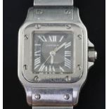 A lady's 2003 stainless steel Cartier Santos automatic wrist watch, with silvery/grey Roman dial and