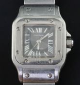 A lady's 2003 stainless steel Cartier Santos automatic wrist watch, with silvery/grey Roman dial and