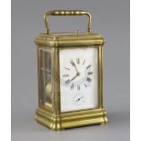 An early 20th century French hour repeating carriage alarum clock, with enamelled Roman dial,