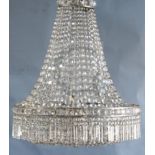 An early to mid 20th century cut glass bag chandelier, hung with spear, square and octagonal cut