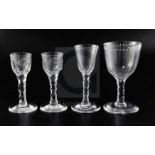 Four facet-stemmed drinking glasses, late 18th century, the pair of cordial/wine glasses engraved
