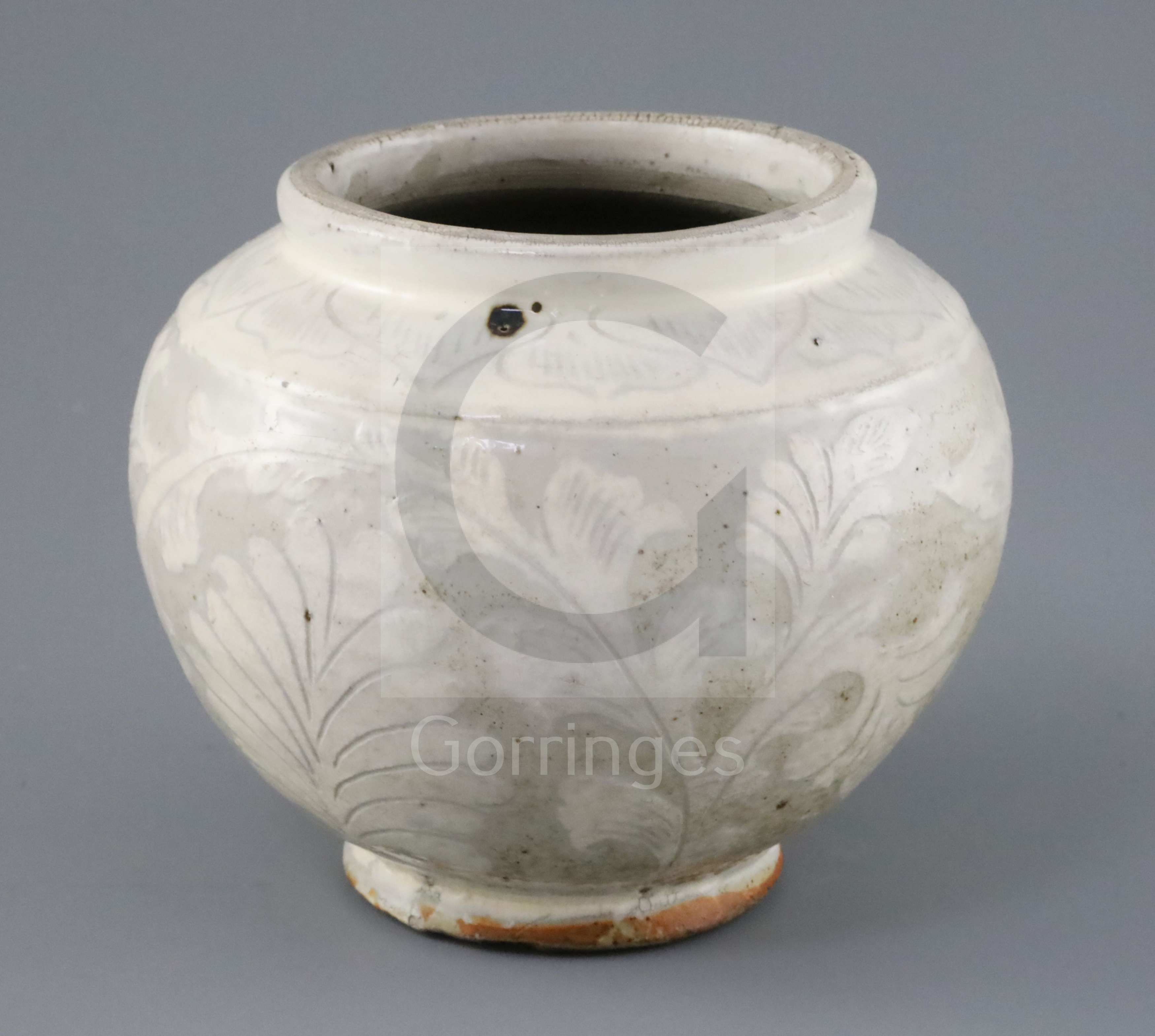 A Chinese Cizhou carved globular jar, probably Song-Jin dynasty the cream glaze incised with