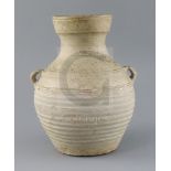 A Chinese pale green glazed jar, Han dynasty, with wavy bands to the neck and a pair of applied